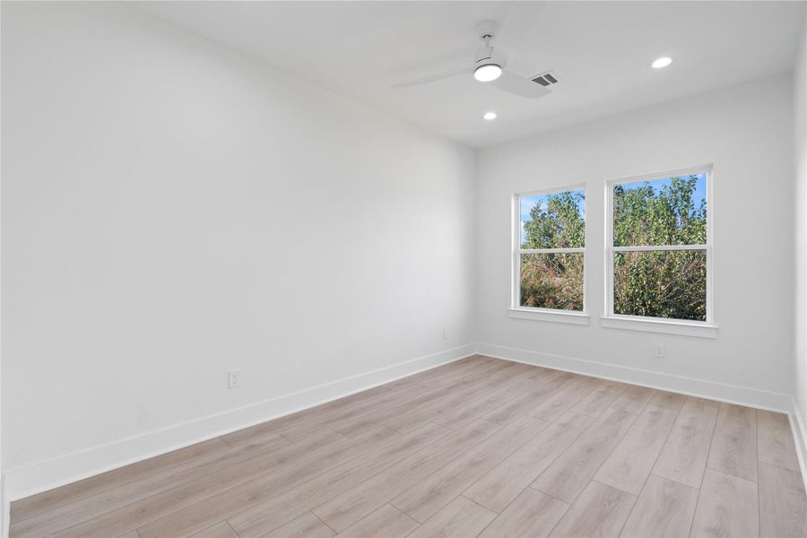 The secondary bedrooms are generously sized, each featuring large windows that fill the rooms with natural light. These bright, airy spaces offer comfort and versatility, perfect for family, guests, or a home office. Thoughtfully designed, they provide both privacy and a welcoming atmosphere for everyone in the home.