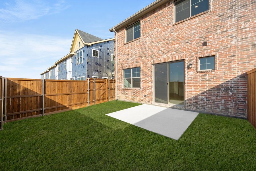 Exterior details and patio area of a home in Wildridge, Oak Point (Image 19).