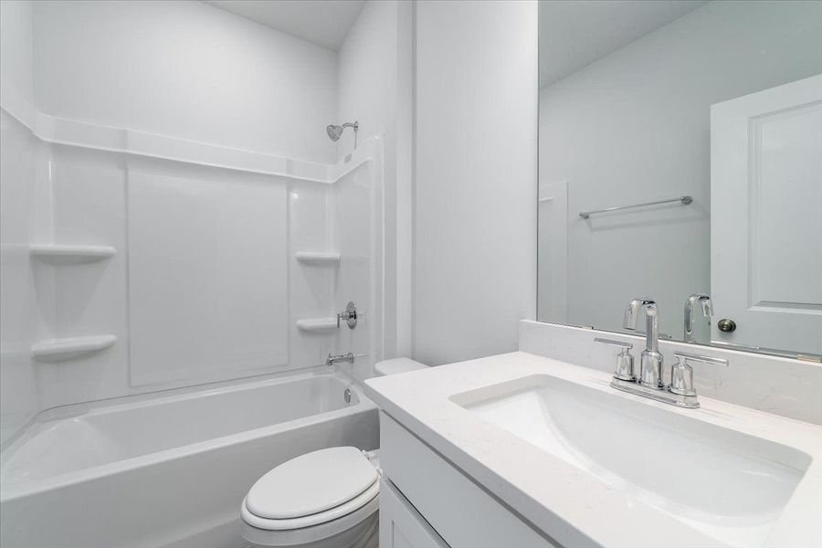 Secondary bathroom with a shower and tub. Secondary bathroom with a shower and tub.