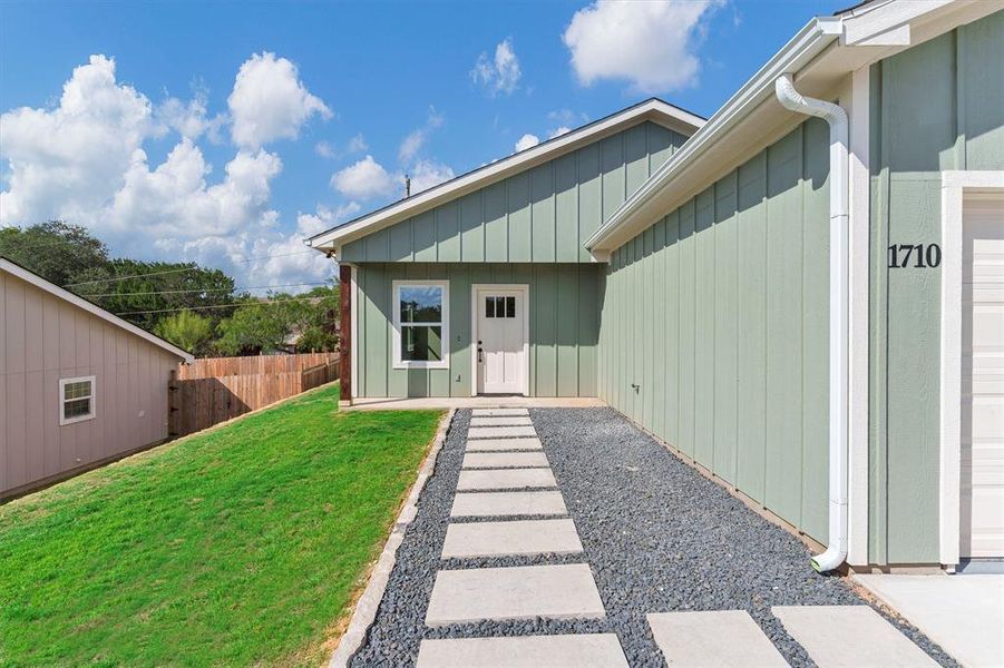 View of exterior entry with board and batten siding