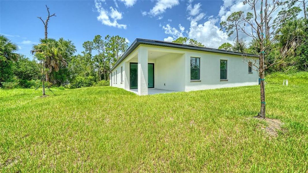 Exterior details and patio area of a home in , North Port (Image 27).