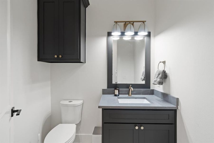 Bathroom featuring toilet and vanity