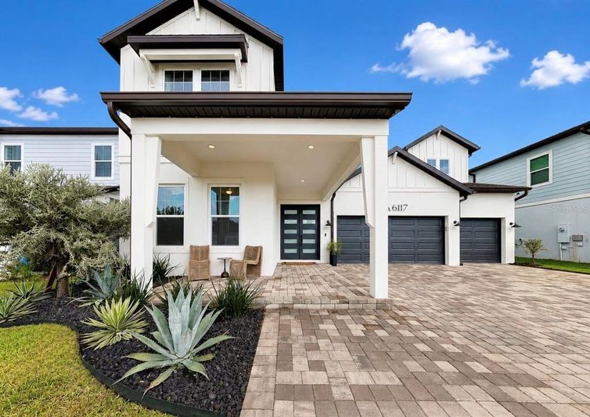Front exterior of a new home in , Apollo Beach, FL, highlighting curb appeal (Image 24). Front exterior of a new home in , Apollo Beach, FL, highlighting curb appeal (Image 24).