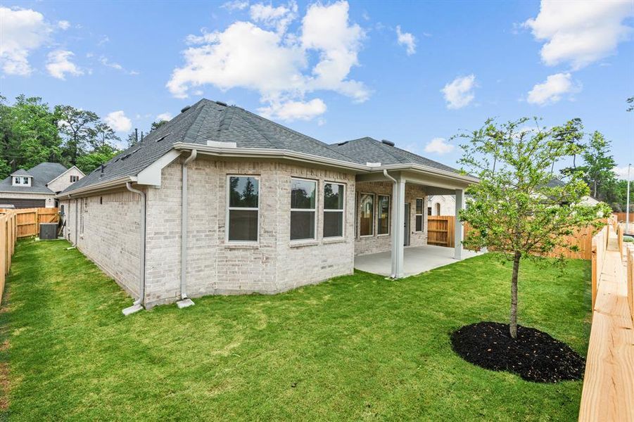 EXAMPLE PHOTO: Fully sodded and fenced rear yard.