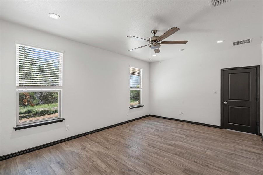 Unfurnished room with wood finished floors, recessed lighting, and a ceiling fan
