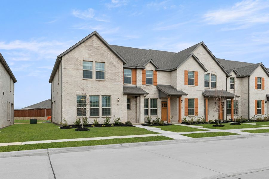 Front exterior of a new home in Sanger Circle – Townhomes, Sanger, TX, highlighting curb appeal (Image 2). Front exterior of a new home in Sanger Circle – Townhomes, Sanger, TX, highlighting curb appeal (Image 2).