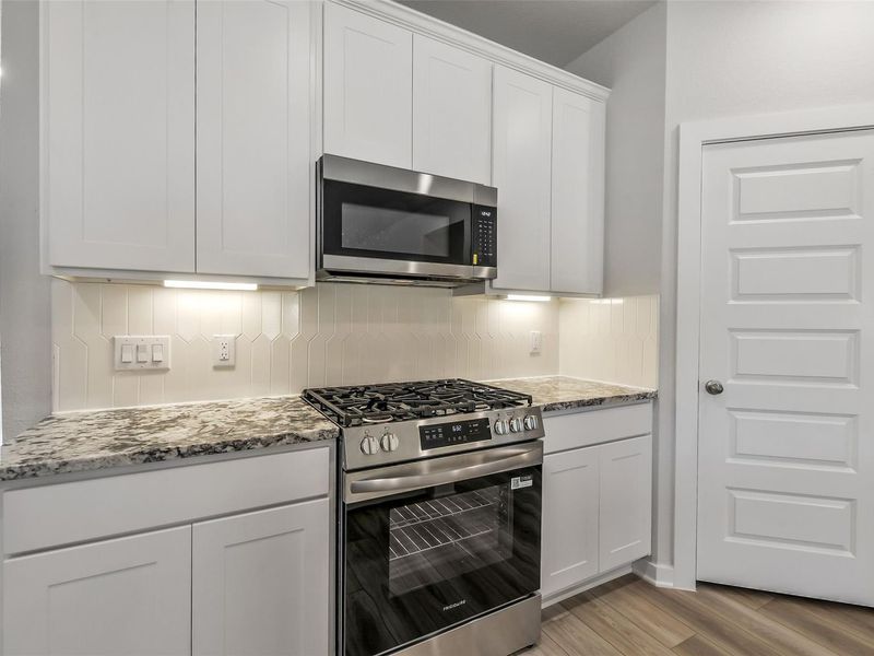 Furnished interior view inside a new home in Caney Creek Place, Conroe (Image 10).