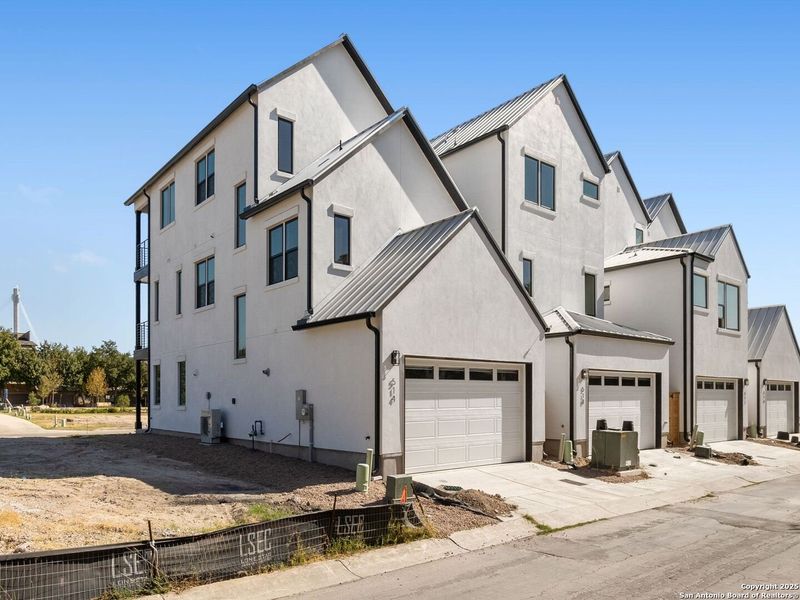 Front exterior of a new home in Victoria Commons, San Antonio, TX, highlighting curb appeal (Image 26).