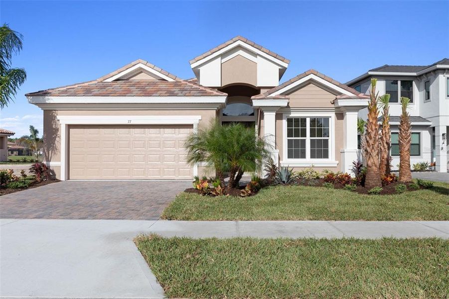 Front exterior of a new home in Marina Del Palma, Palm Coast, FL, highlighting curb appeal (Image 33).
