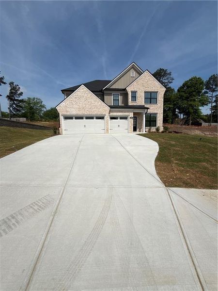 Front exterior of a new home in , Lawrenceville, GA, highlighting curb appeal (Image 1). Front exterior of a new home in , Lawrenceville, GA, highlighting curb appeal (Image 1).
