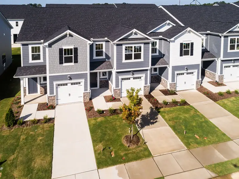 Front exterior of a new home in Vaughan Farms, Angier, NC, highlighting curb appeal (Image 1). Front exterior of a new home in Vaughan Farms, Angier, NC, highlighting curb appeal (Image 1).