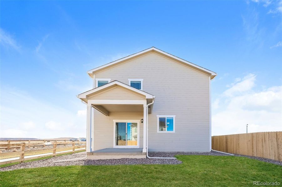Exterior details and patio area of a home in Second Creek Farm, Commerce City (Image 13).