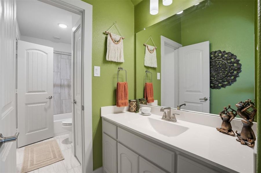 Full bath featuring vanity and shower / bath combo Full bath featuring vanity and shower / bath combo