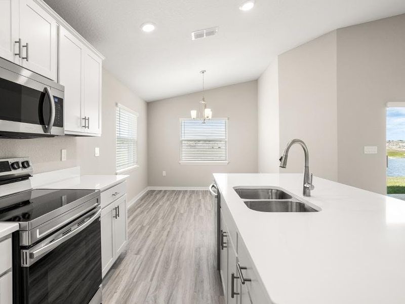 Dine at the island, or the adjacent sunny cafe - Sophia by Highland Homes