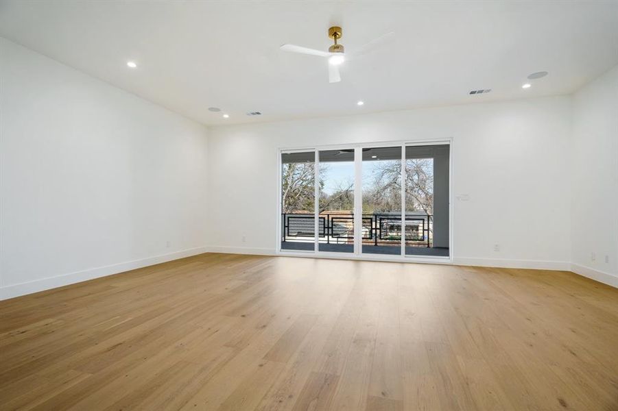 Spare room with ceiling fan and light hardwood / wood-style flooring