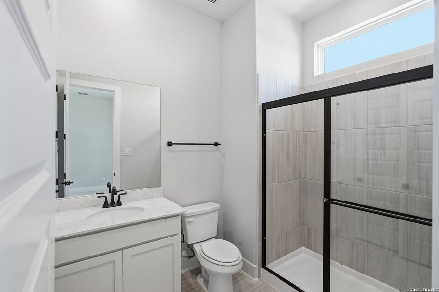 Furnished interior view inside a new home in Potranco Oaks, Castroville (Image 13).