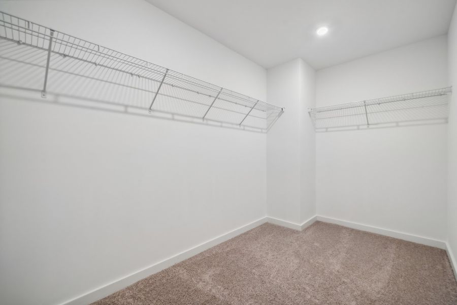 A room with a carpet and a metal railing. A room with a carpet and a metal railing.