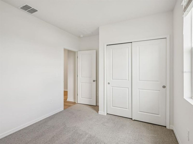 Spacious, unfurnished interior of a new home in The Reserve at Van Oaks, Auburndale (Image 11).