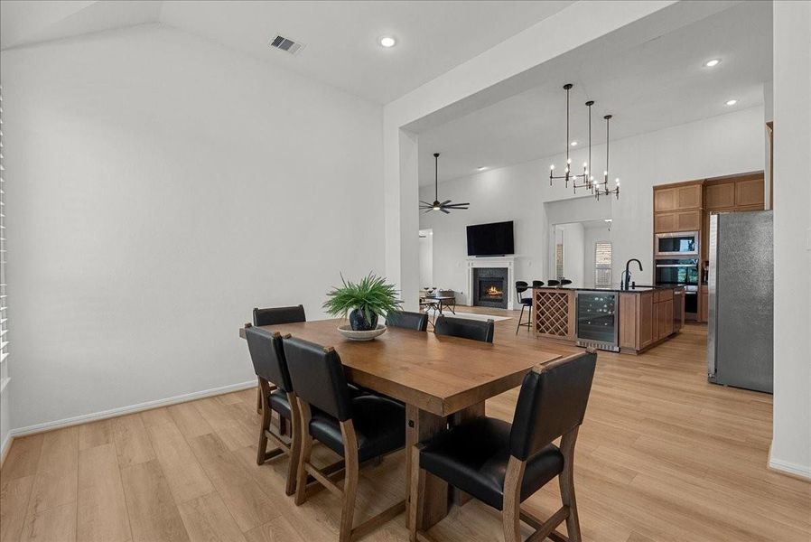 Formal dining room with serene water views, creating the perfect setting for entertaining and gatherings.