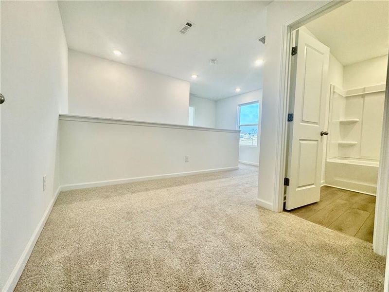 Spacious, unfurnished interior of a new home in Eastlyn Crossing, Flowery Branch (Image 21).