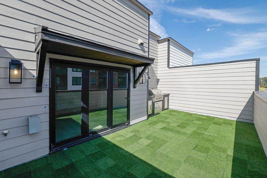 Exterior details and patio area of a home in Skyview On Broad, Sugar Hill (Image 19).