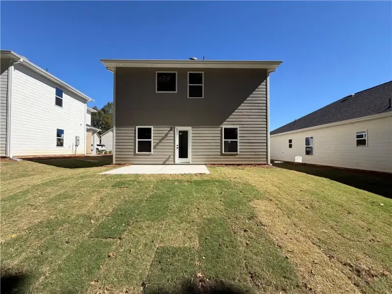 Exterior details and patio area of a home in Canterbury Villas, Carrollton (Image 20).