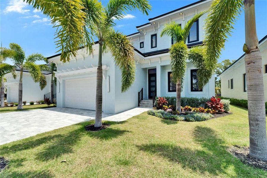 Front exterior of a new home in , Apollo Beach, FL, highlighting curb appeal (Image 1).