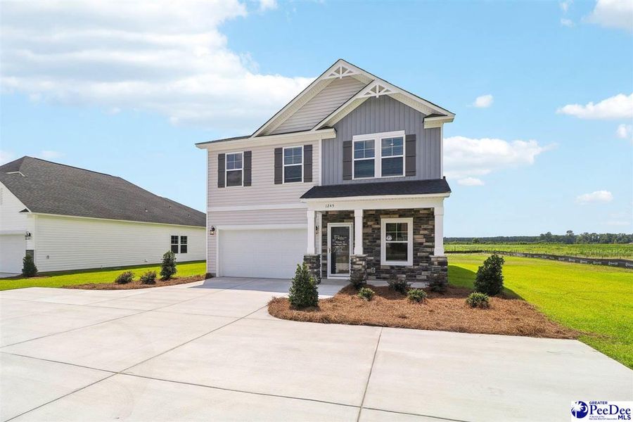 Front exterior of a new home in Southern Columns, Florence, SC, highlighting curb appeal (Image 24).