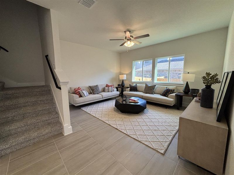 Living room featuring ceiling fan