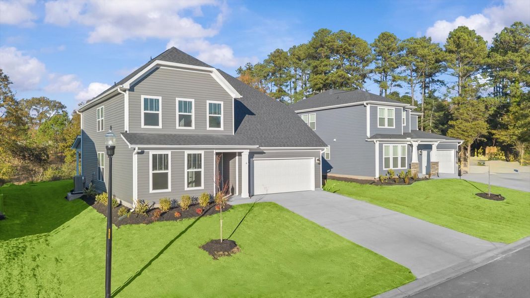 Front exterior of a new home in Woodglen, Piedmont, SC, highlighting curb appeal (Image 20).