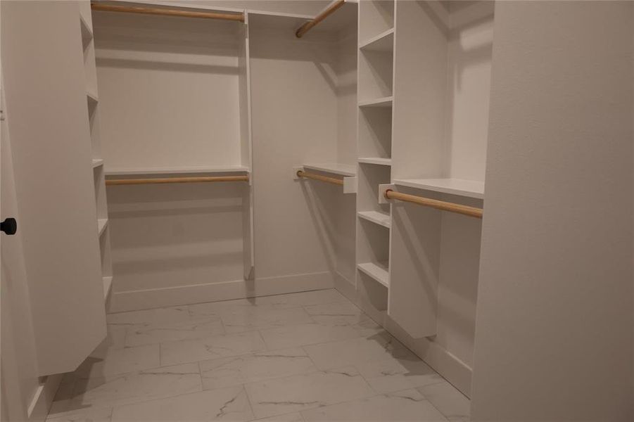 Walk in closet featuring light tile patterned floors