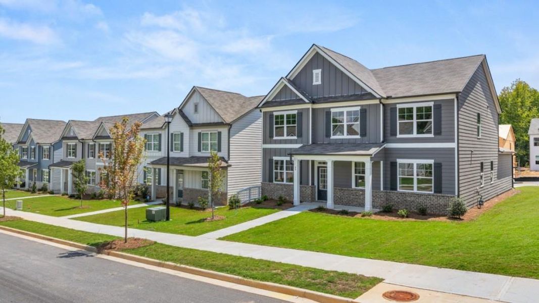 Front exterior of a new home in Braselton Village, Braselton, GA, highlighting curb appeal (Image 18). Front exterior of a new home in Braselton Village, Braselton, GA, highlighting curb appeal (Image 18).
