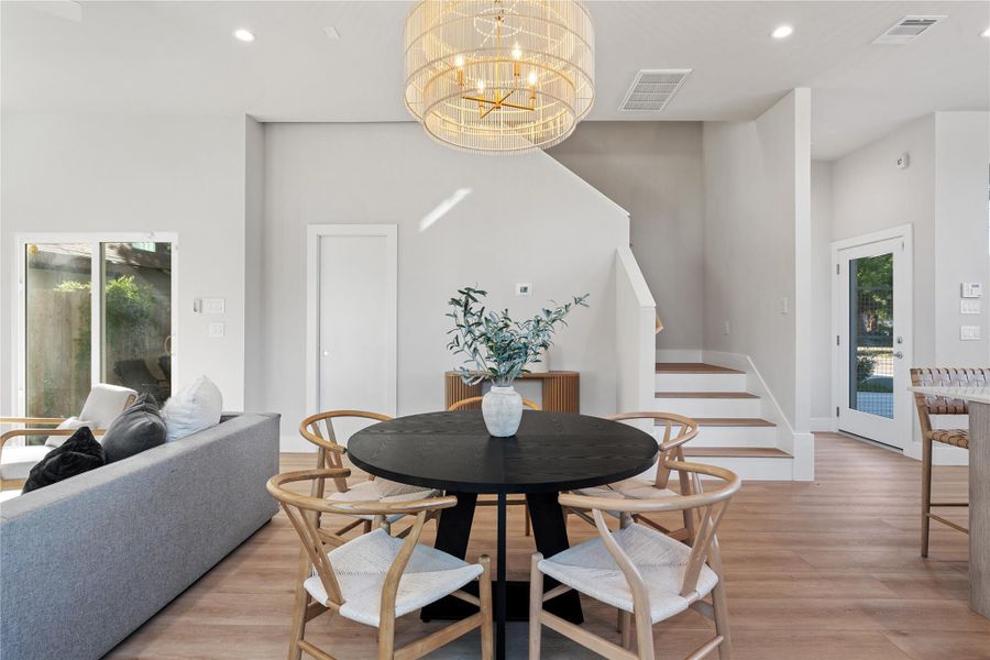 Warm & inviting dining space framed by designer lighting, clean architectural lines & easy access to the home’s main living areas. Warm & inviting dining space framed by designer lighting, clean architectural lines & easy access to the home’s main living areas.