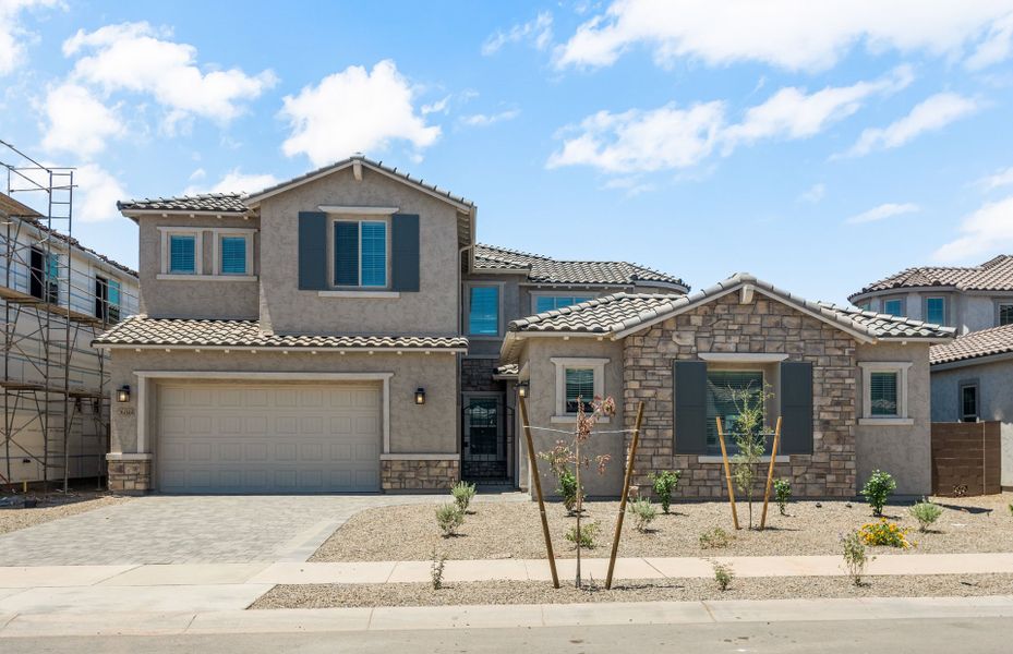 Front exterior of a new home in Harvest - Enchantment Series, Queen Creek, AZ, highlighting curb appeal (Image 25). Front exterior of a new home in Harvest - Enchantment Series, Queen Creek, AZ, highlighting curb appeal (Image 25).