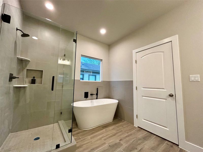 Primary bathroom with separate shower and soak-in tub.