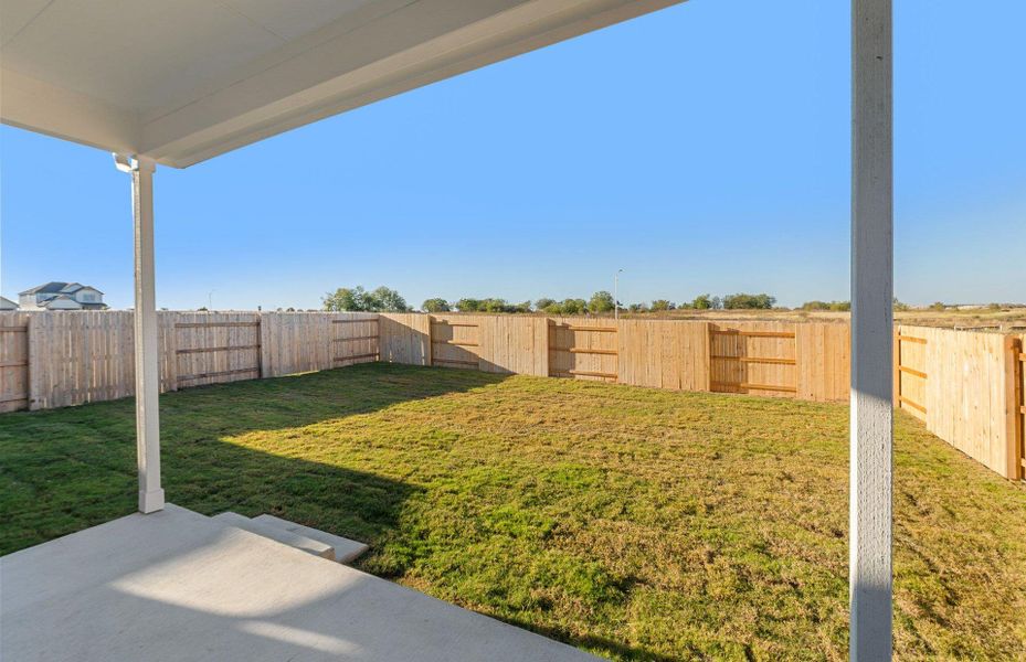 Fenced backyard featuring a patio area