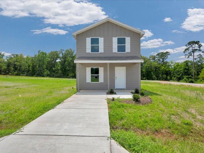 Front exterior of a new home in Redland Estates, Lufkin, TX, highlighting curb appeal (Image 1). Front exterior of a new home in Redland Estates, Lufkin, TX, highlighting curb appeal (Image 1).