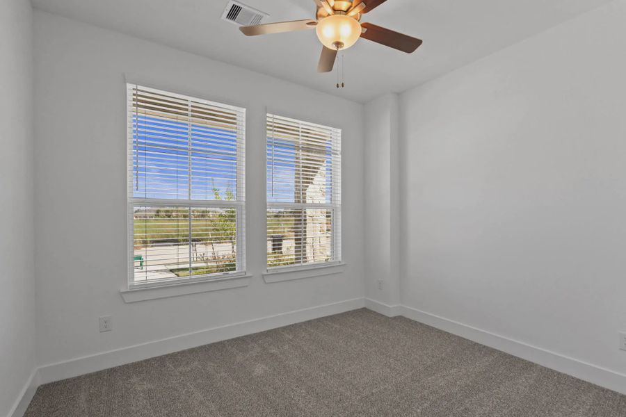 Representative unfurnished interior of a home built from the Carriagehouse by Chesmar Homes in Meridiana Townhomes, Iowa Colony (Image 74).