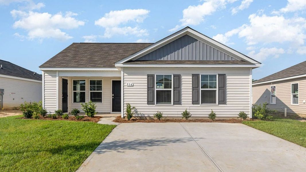 Representative exterior photo of a completed home built from the CURTIS by D.R. Horton in The Cottages at Blake Farm, Wilmington, NC (Image 1). Representative exterior photo of a completed home built from the CURTIS by D.R. Horton in The Cottages at Blake Farm, Wilmington, NC (Image 1).