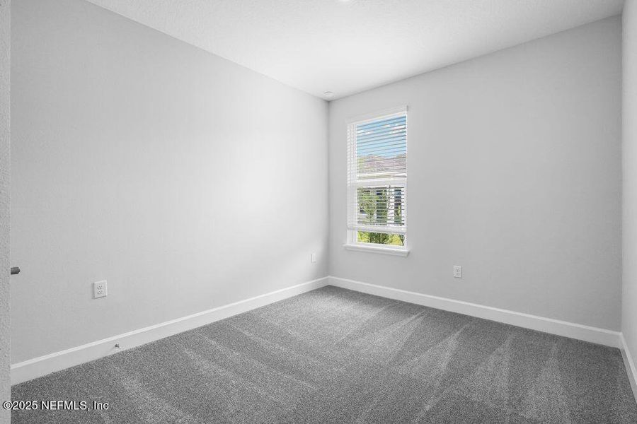 Spacious, unfurnished interior of a new home in Colbert Landings, Palm Coast (Image 25).