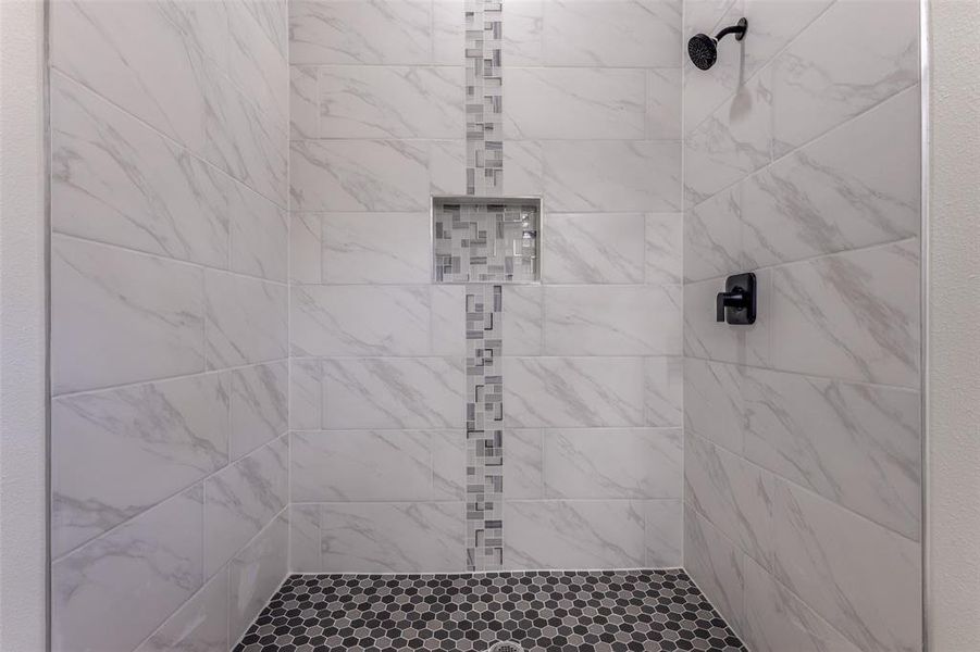 Bathroom with tiled shower