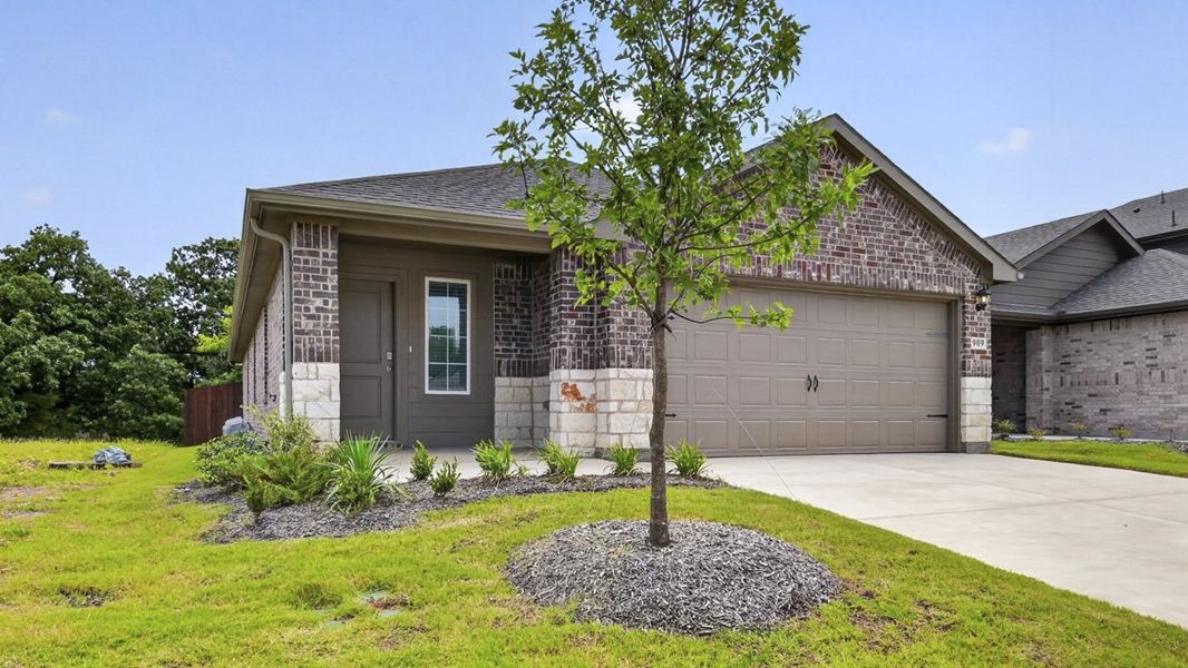 Front exterior of a new home in Hanolley Hills, Sherman, TX, highlighting curb appeal (Image 2). Front exterior of a new home in Hanolley Hills, Sherman, TX, highlighting curb appeal (Image 2).