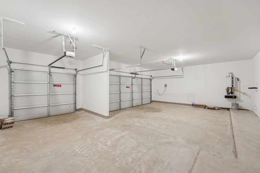 Garage featuring a garage door opener