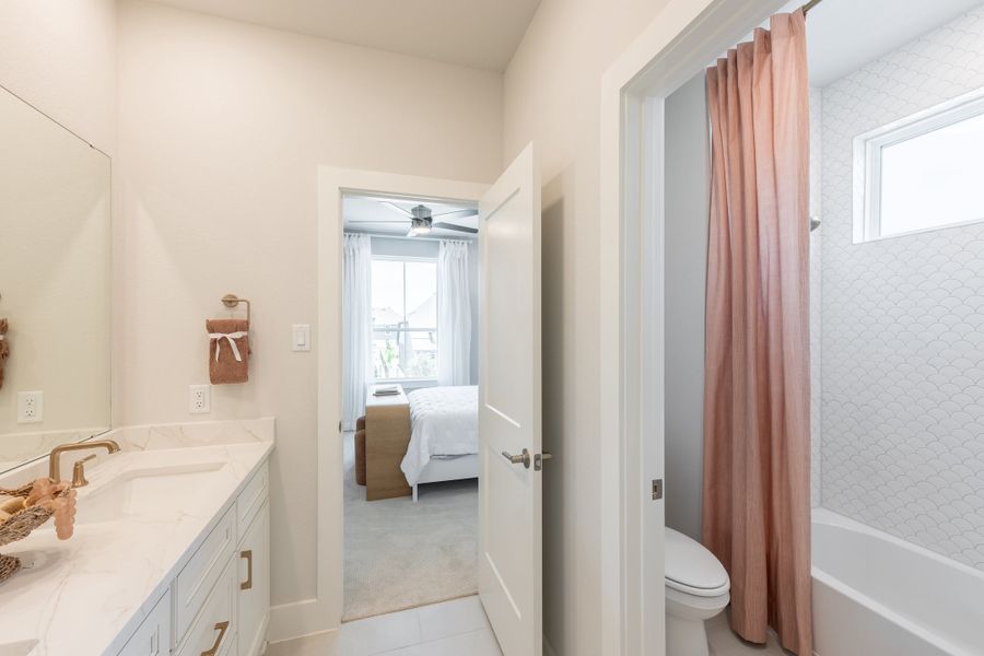 Representative furnished interior of a home built from the Woodbridge by Tri Pointe Homes in Bridgeland, Cypress (Image 40).