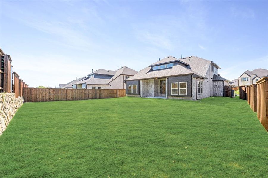 Exterior details and patio area of a home in Windsong Ranch Classic 61, Prosper (Image 21). Exterior details and patio area of a home in Windsong Ranch Classic 61, Prosper (Image 21).