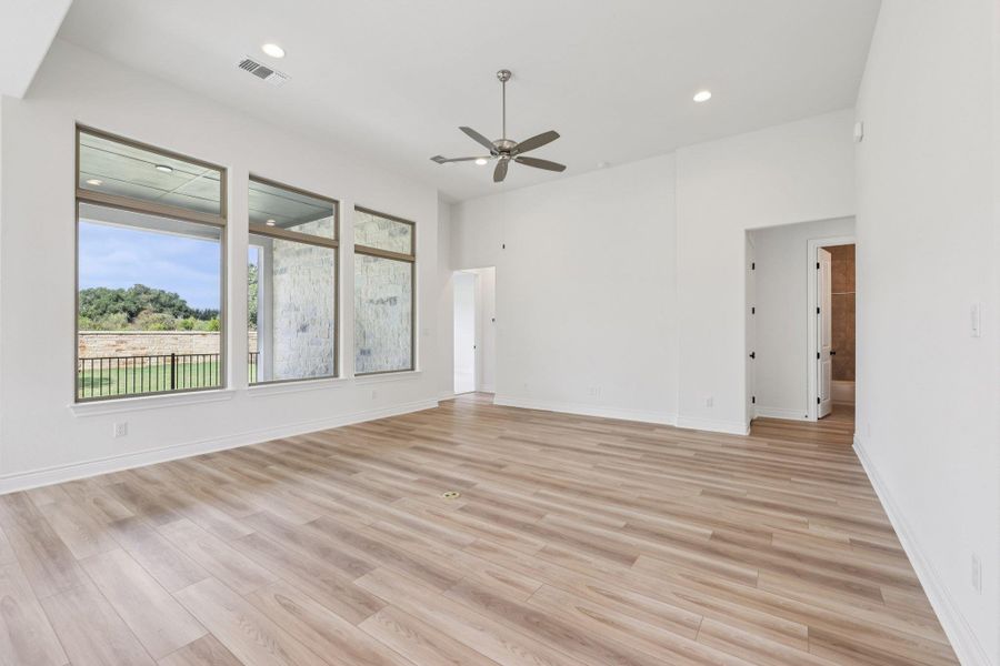Unfurnished room with recessed lighting, light wood finished floors, and ceiling fan
