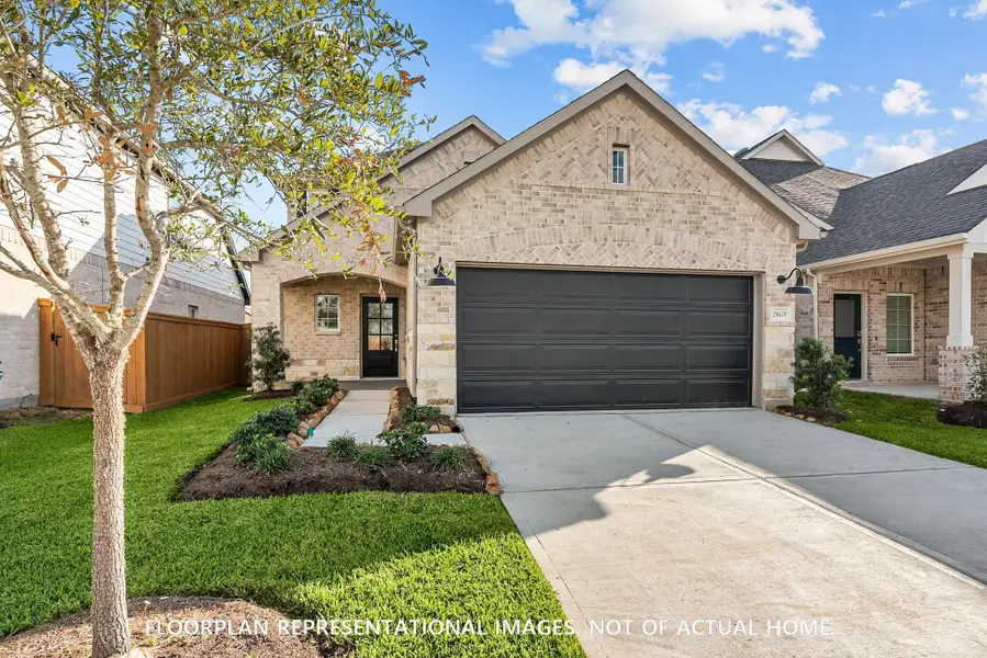 Front exterior of a new home in Wildrye, Waller, TX, highlighting curb appeal (Image 1). Front exterior of a new home in Wildrye, Waller, TX, highlighting curb appeal (Image 1).