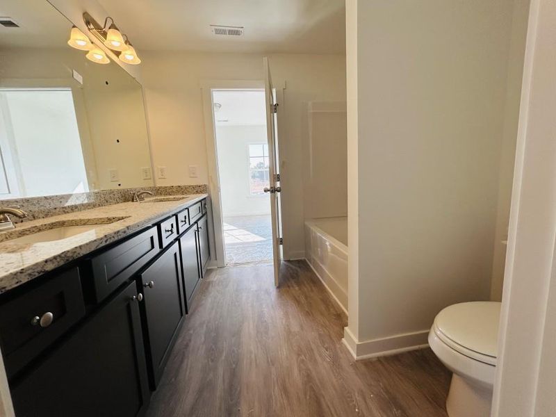 Furnished interior view inside a new home in Sutton's Landing, Statham (Image 10).