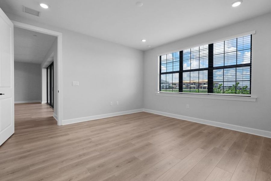 Spacious, unfurnished interior of a new home in Esplanade by the Islands Coach Homes, Naples (Image 12).