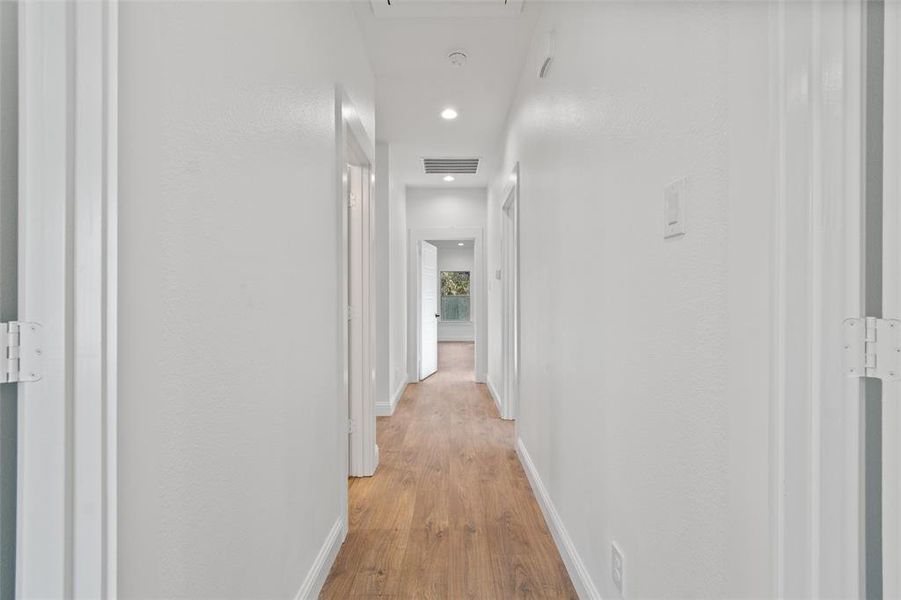 Hallway featuring light hardwood / wood-style flooring